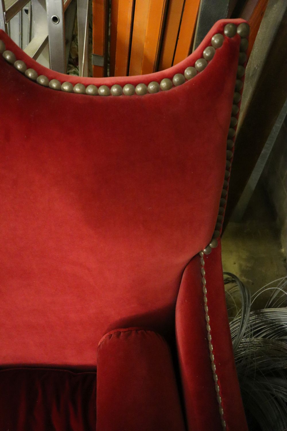 An Yves Halard two-seater sofa covered in red velvet, width 125cm depth 85cm height 132cm